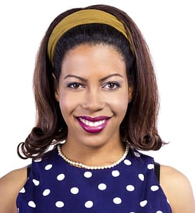 Black woman with pushed-back, medium-length haircut
