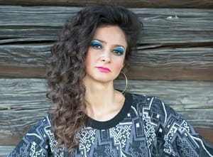 Side sweeping 90s heavy part on curly hair
